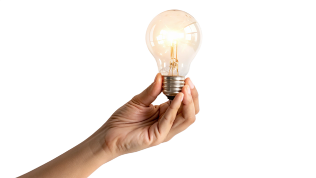Hand holding a glowing incandescent light bulb with a bright idea symbol