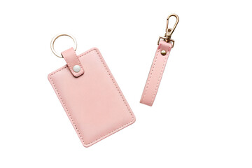 Two light pink leather card holders with keychains isolated on transparent background