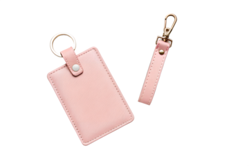Two light pink leather card holders with keychains isolated on transparent background