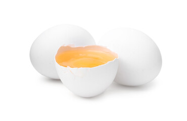 Whole and broken chicken eggs isolated on white