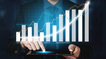 An engaged businessman uses a tablet to analyze digital data trends, showcasing dynamic graphs depicting growth and performance in a sophisticated office environment. Copula