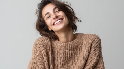 Fototapeta premium HR professional smiling warmly while wearing a cozy sweater in a minimalistic setting