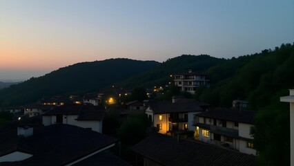 The lights of thousands of homes in the dusk mountain city