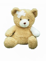 Teddy bear with bandage isolated on white background injury brown teddy bear.