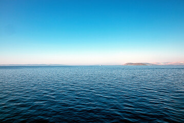 Calm blue sea horizon and blue sky
Wide open sea horizon with clear blue sky. Minimalist seascape for backgrounds and concepts of freedom.