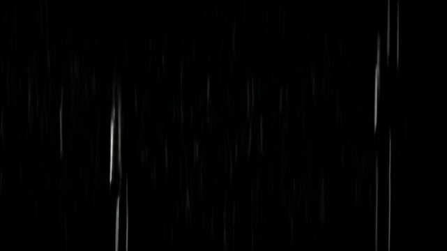 Rain streaks falling vertically against a black background