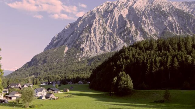Timelapse of Grimming Mountain and Alpine Village in Styria, Austria at Sunset