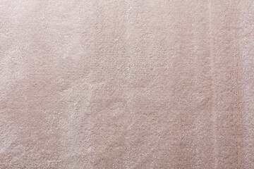 Beautiful beige soft shaggy carpets rugs texture close up.