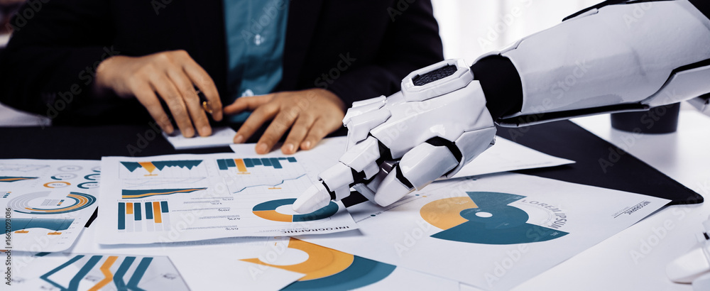 Poster a robotic hand is analyzing business charts and graphs on a desk, showcasing the integration of tech