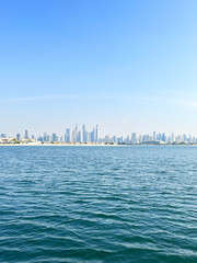 Dubai Skyline A Coastal View of the City's Modern Architecture Under a Clear Blue Sky