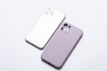 Modern smartphone with purple protective case on white background