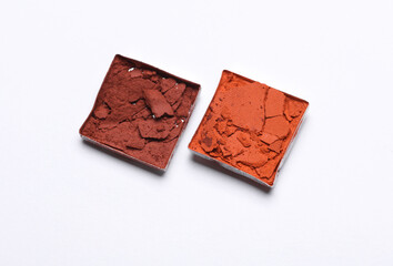 Crushed eyeshadow for makeup. Cosmetic product sample on white background.