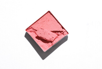 Crushed eyeshadow for makeup. Cosmetic product sample on white background. Creative layout. Beauty make concept. Top view