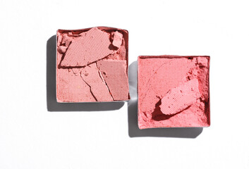 Crushed eyeshadow for makeup. Cosmetic product sample on white background. Creative layout. Beauty make concept. Top view