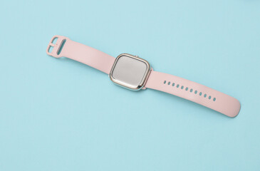 Modern smart watch bracelet on blue background