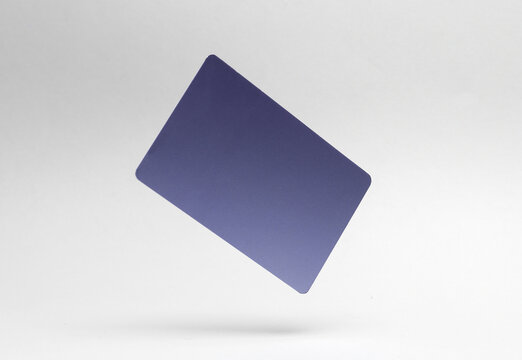 Purple metal business card or credit card mockup levitating on white background