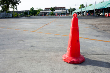 Traffic cone on the road, close-up of a cone