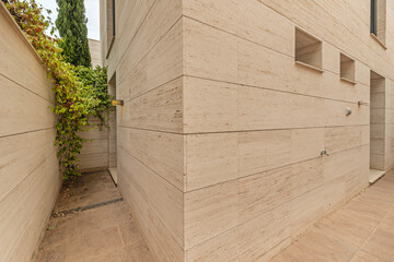 House Minimalist single-family home with  white marble facade and floating perimeter walkway