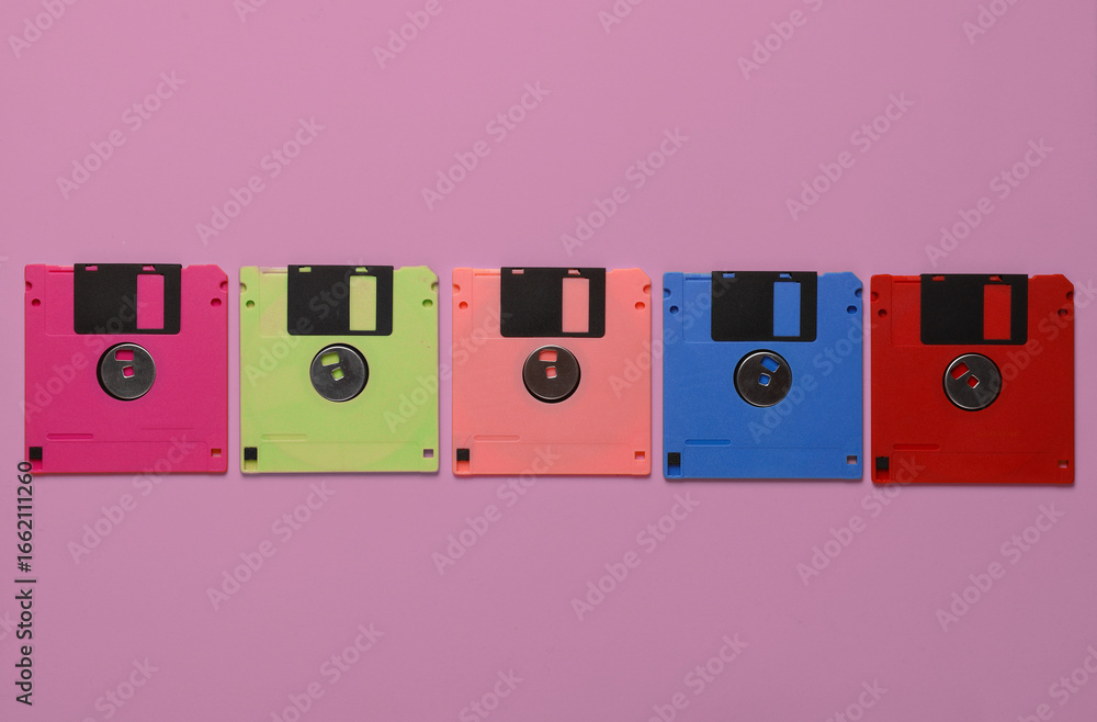 Poster set of colored floppy disks on a pink background