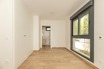 Empty teen's bedroom with futuristic white cabinets and an app-controllable RGB interior lighting...