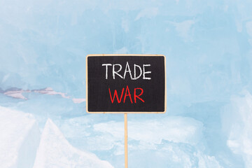 Trade war symbol. Concept word Trade war on beautiful black blackboard. Beautiful Baikal blue ice...