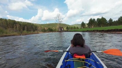 Indulge in a soothing kayak excursion along a tranquil river, enveloped by lush greenery and a stunning skyperfect for nature enthusiasts in search of refreshing outdoor experiences and adventures