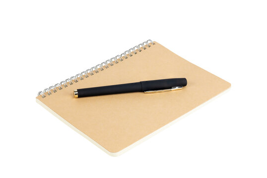 Black pen on a spiral craft paper notebook for writing, journaling, planning, or study, isolated on white background with clipping path.