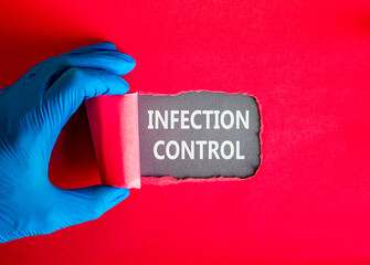 Infection control symbol. Concept words Infection control on beautiful grey paper. Doctor hand in...