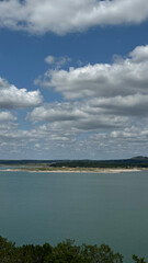 Serene lake view under cloudy sky with expansive scenery – travel agencies, outdoor adventure companies, print media concept of