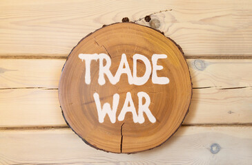 Trade war symbol. Concept word Trade war on beautiful wooden circle on wooden wall. Beautiful...
