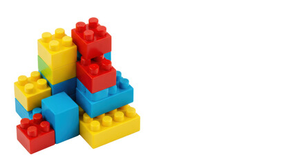 Naklejka premium Bright, primary colored plastic interlocking toy blocks, red, yellow, blue, green, flat lay on transparent background with copy space, concept of foundational education