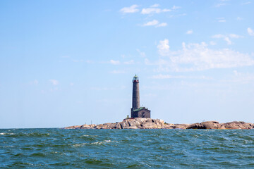 Bengtskar Lighthouse near Hanko, Finland. Tallest lighthouse in Scandinavia, rising above Baltic Sea, surrounded by rocky islands. Historic maritime landmark and popular tourist destination