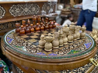 Handcrafted wooden chess set with ornate board and pieces for game enthusiasts