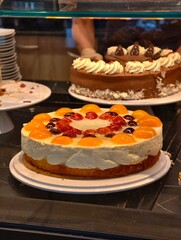 Delicious fruit cake with apricot and strawberry toppings perfect for dessert time