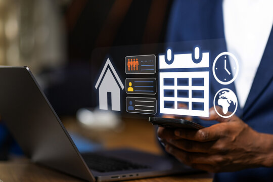 African Businessman managing work schedule on his smartphone, synchronizing his calendar and tasks seamlessly between mobile and desktop devices.