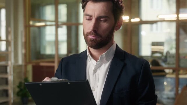 Caucasian thoughtful businessman middle-aged guy business man writing document in office male expert auditor broker real estate agent analyst thinking consider write bank papers contract deal planning