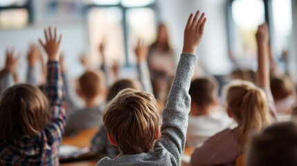 pupils raising their hands during class at the elementary school no logos no brands ar 169