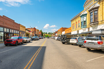 The historic 19th century Main Street through the charming Old West themed small town of Livingston, Montana, a popular road trip stop in the American West.