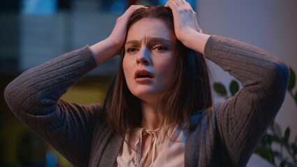 Stressed angry furious woman Caucasian crazy insane sad girl at night evening home apartment...
