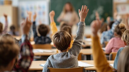 pupils raising their hands during class at the elementary school no logos no brands ar 169