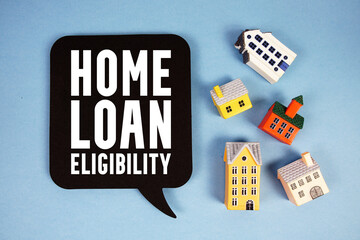 Home Loan Eligibility text with house models on blue background