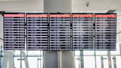 Busy International Airport Departure Board Display