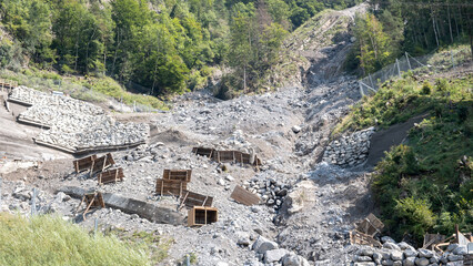 Protection against rockfalls, landslides in the mountains of Switzerland. Temporary metal shields...