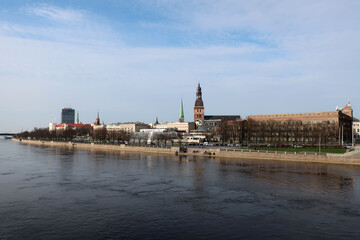 Riga, Latvia. The Daugava or Western Dvina is a large river rising in the Valdai Hills of Russia that flows through Belarus and Latvia into the Gulf of Riga of the Baltic Sea.