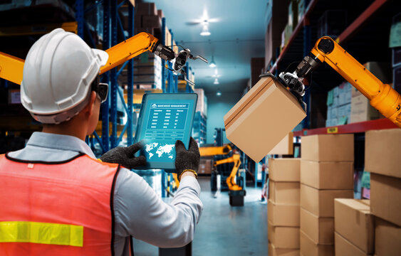Smart robot arm systems for innovative warehouse and factory digital technology . Automation manufacturing robot controlled by industry engineering using IOT software connected to internet network .