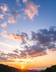 Naklejka premium Sunset sky over hills