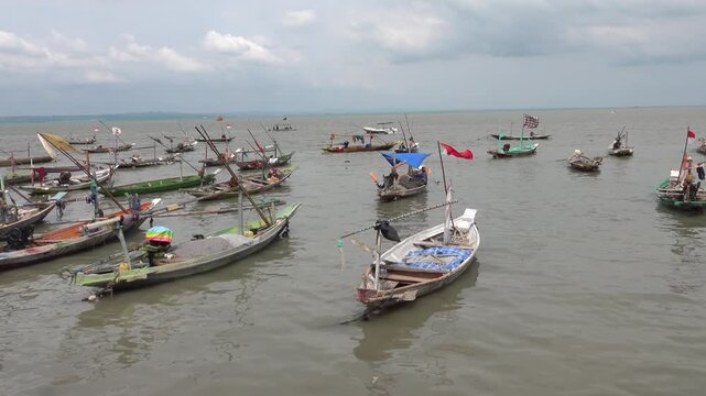 Indonesia, Surabaya flotilla of small fishing johnboat on Java Sea,