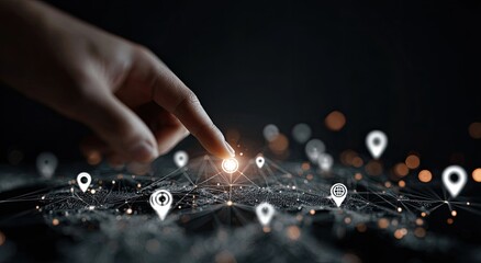 A hand points to a network of location markers.  A hand's fingertip touches a glowing location marker in a network of connected markers on a dark background.  Digital network of location data