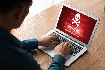 Virus warning alert on computer screen detected modish cyber threat , hacker, computer virus and...