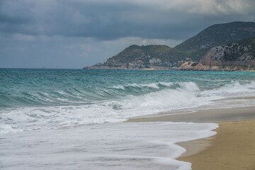 Tropical beach with golden sand and turquoise sea in summer